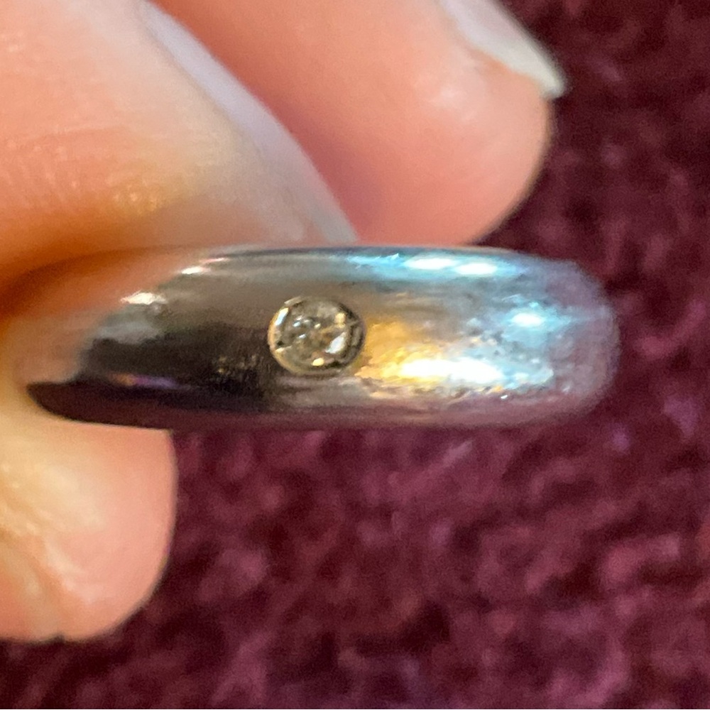 14k white gold small ring with diamond chip. Size 6